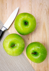 fresh green apples on a table