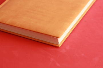 book with orange cover on colorful background