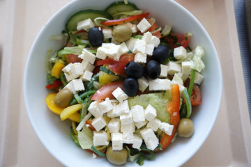 Peasant salad with fresh cheese Olives and tomatoes with tea and bread