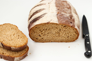 Sliced whole grain flour bread , located on a white background, top view