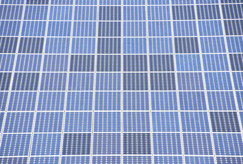 background of photovoltaic solar panels,  natural energy source, symetric blue background