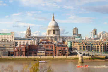 Fototapeta na wymiar Millennium Bridge and Saint Paul's Cathedral. Panoramic cityscape view of London.