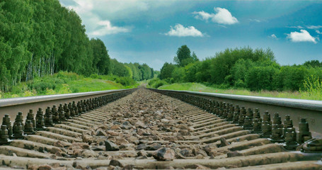 Fototapeta na wymiar 2725_Black_railway_track_of_a_train_with_big_stones_inside0002.jpg