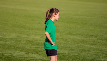 Little girl in a soccer training