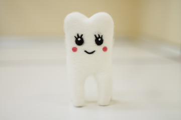 toy tooth of wool white close-up