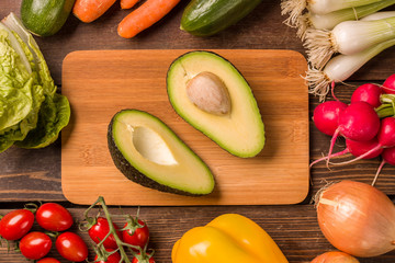 Avocado and other fresh vegetables and ingredients for cooking