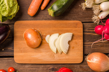 Onion and other fresh vegetables and ingredients for cooking