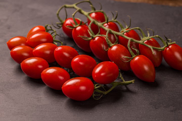 Tomato on black background