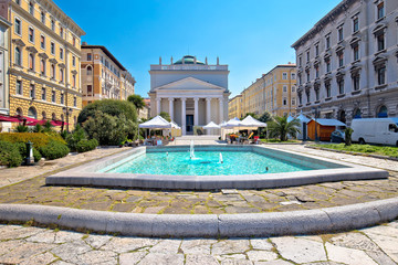 Naklejka premium Trieste Piazza Sant Antonio Nuovo fountain and church colorful view