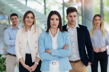 Fototapeta premium Group of happy business people and company staff in modern office, representig company