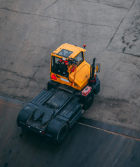 Tug master in the port waiting to unload trailers from the arriving car ferry