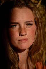 Fototapeta premium portrait of a young beautiful girl with freckles