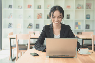 Successful business woman working on laptop computer.Typing laptop keyboard on working...