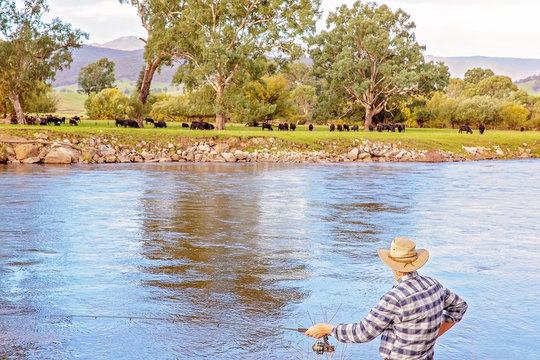 Retiree Fly Fishing On Murray River Australia