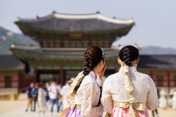 two traditional girls in hanbok visiting gyeongbok palace Seoul Korea - gyeongbokgung
