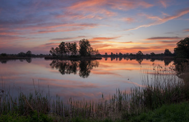 Fototapeta na wymiar spring colorful dawn on the lake