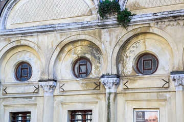 old wall with round Windows