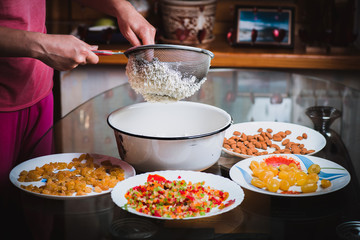 The process of making traditional Easter molded cottage cheese dessert paska.