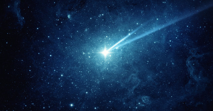 Falling meteorite, asteroid, comet in the starry sky. Elements of this image furnished by NASA.
