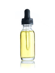 Bottle of essential oil isolated over the white background