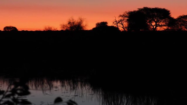 Sunset scenery of Okavango River looking into Angola from Namibia Caprivi Strip