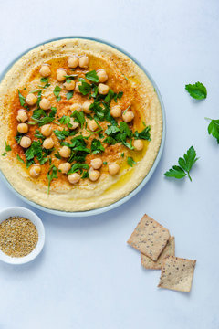 Plate of hummus with crackers