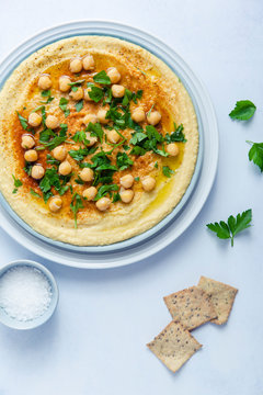Hummus with crackers and salt cellar