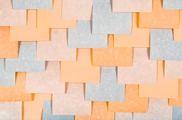 Gray and peach colored blank notes