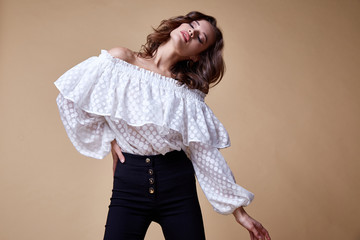 Sexy beautiful woman fashion glamour model brunette hair makeup wear silk blouse trousers clothes...