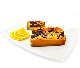 Sliced plum pie with almonds