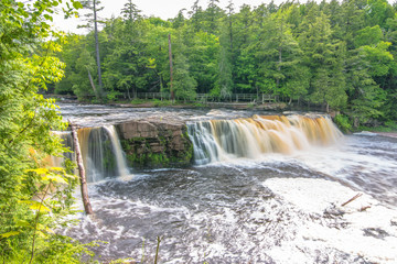 Beautiful waterfall at Porcupine Mountains Wilderness State Park in the Upper Peninsula of Michigan - smooth tranquil flowing water