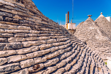 Alberobello, Italy - March 9, 2019: View of the streets of this curious Italian city visited by...