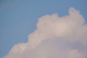 Beautiful white puffy clouds with pretty blue sky - nature background