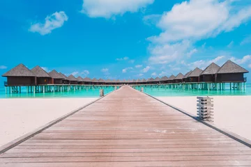 Fotobehang Water bungalows and wooden jetty on Maldives © travnikovstudio