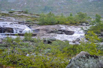 Naklejka na ściany i meble Trolltunga hike, Lake Ringedalsvatnet, Norway, Beautiful scandinavian landscape, Scandianavia, summer nature. Hike starts from Odda town