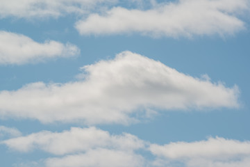 Beautiful white puffy clouds with pretty blue sky - nature background