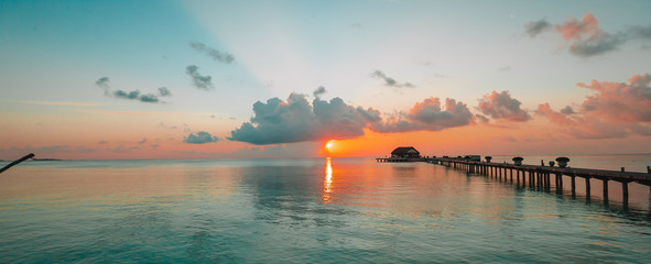 Beautiful colorful sunset in tropical island at Maldives