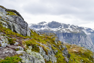 Fototapeta na wymiar Trolltunga hike, Lake Ringedalsvatnet, Norway, Beautiful scandinavian landscape, Scandianavia, summer nature. Hike starts from Odda town