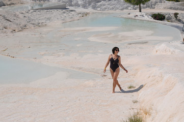 Beautiful girl sunbathes on the shore. Relaxation. Vacation Artistic noise