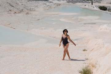 Beautiful girl sunbathes on the shore. Relaxation. Vacation Artistic noise