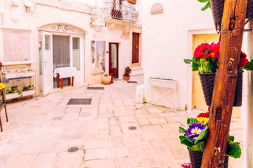 Facades of old Italian Mediterranean houses in Bari painted in colors.