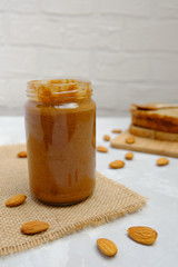 Almond butter on neutral backgound, selective focus