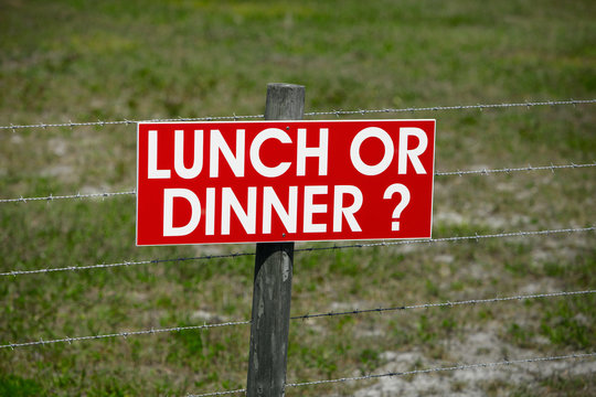 Sign on a Barbwire Fence