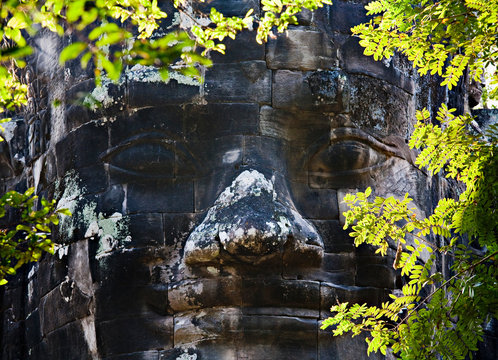 Carved stone face, Angkor, Cambodia
