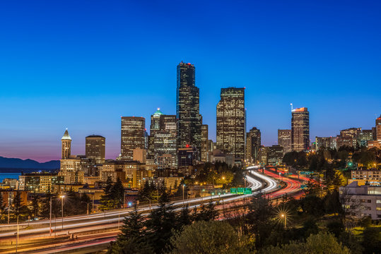 City skyline lit up at night, Seattle, Washington, United States