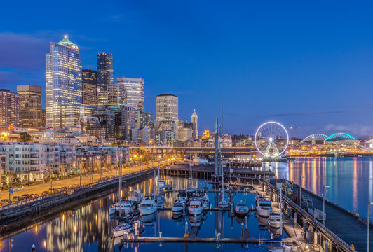 City skyline lit up at night, Seattle, Washington, United States