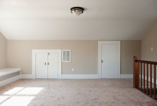 Closets in empty attic room