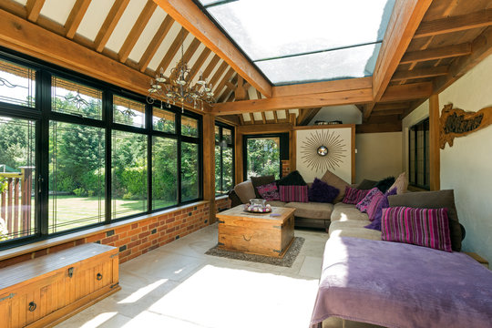 Cushioned benches in sunny conservatory