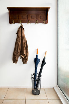Jacket and umbrellas in foyer of home