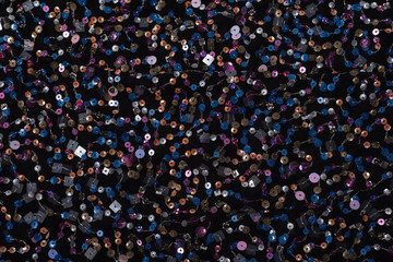 Texture of black cloth with colorful sequins. Close-up.